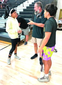 Benjy Scarbor talking to two Packer wrestlers