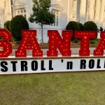 santa stroll and roll sign