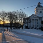 sun and snow over courthouse