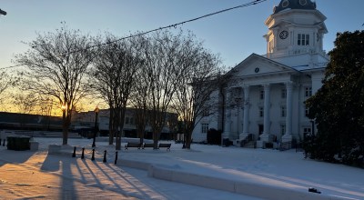 sun and snow over courthouse