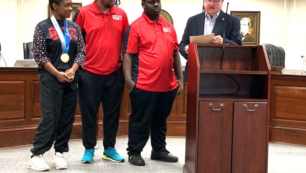 Special Olympians and coach