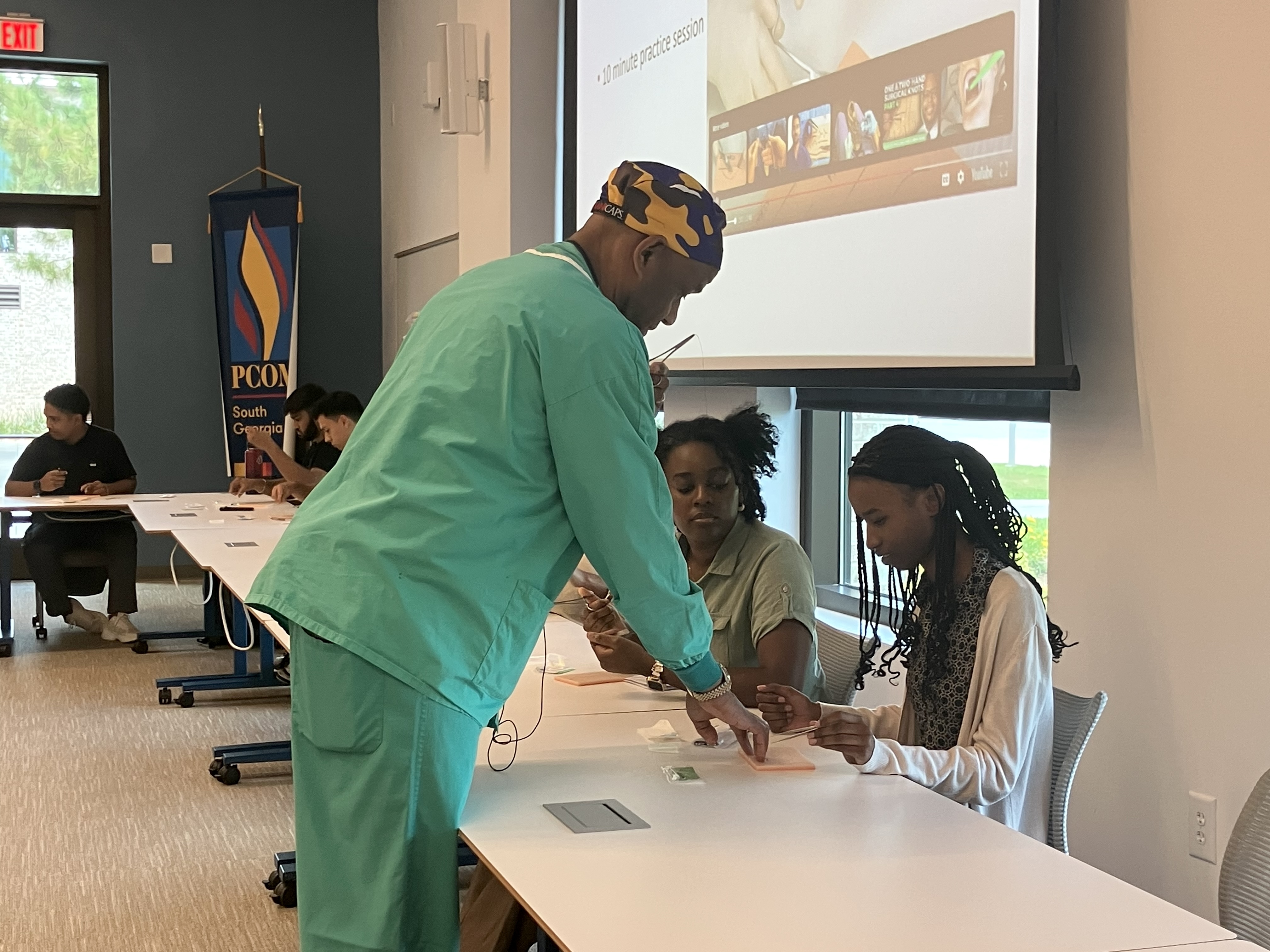 FIRE suturing class instructor with students