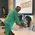 FIRE suturing class instructor with students