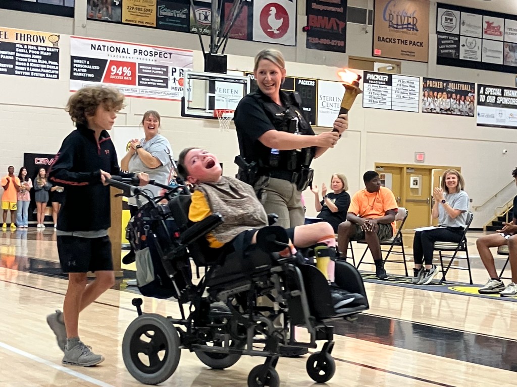 Special Olympics athletes with Flame of Hope