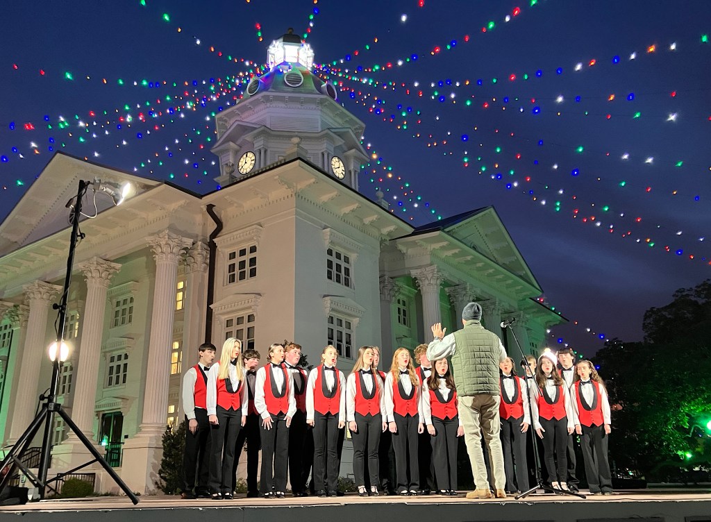 serenaders perform under downtown lights